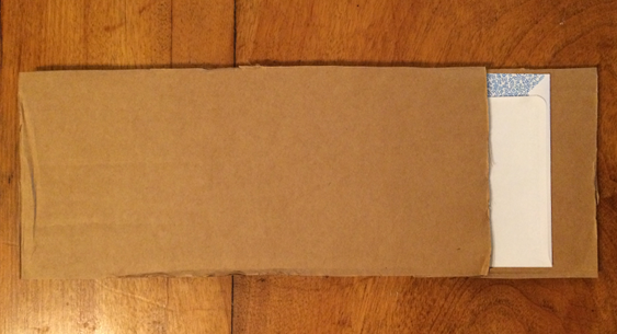 How to Pack - Sandwich envelope between cardboard