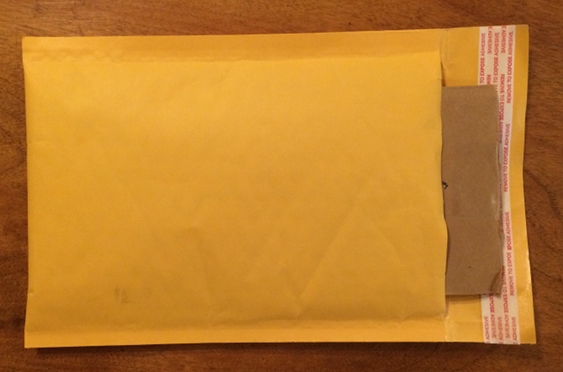 How to Pack - Sandwich envelope between cardboard